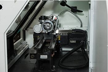 TensileTurn CNC Classic – inside view of the round tensile sample preparation machine
